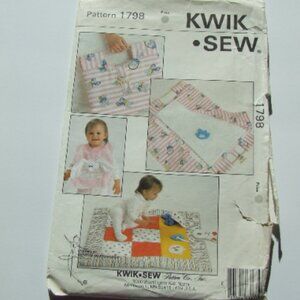 Baby linens sewing pattern Kwik Sew vintage uncut bib change pad play quilt toys